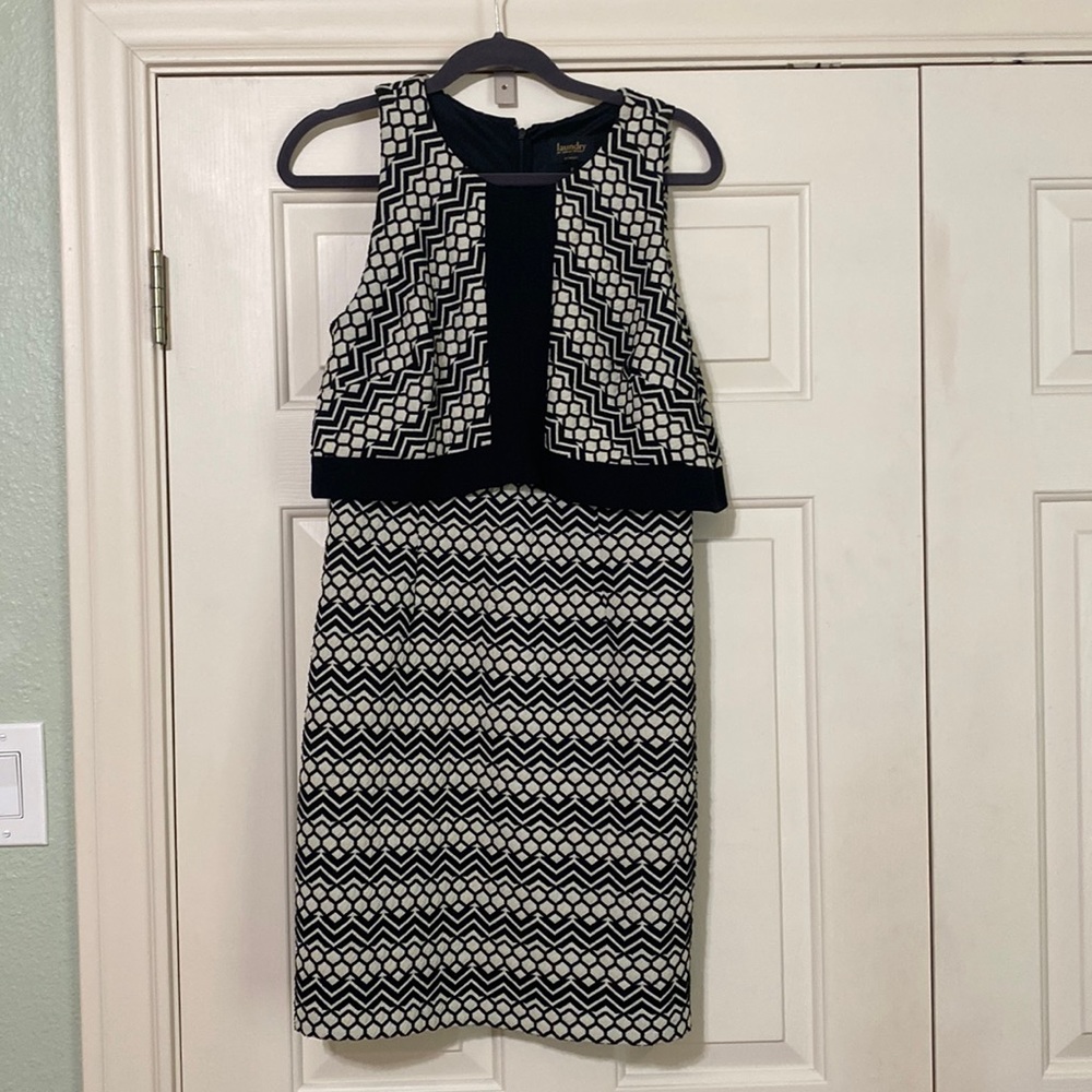 Sleeveless dress that looks like a top and bottom ensemble.